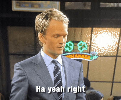 Man In Suit Says Ha Yeah Right At Shamrock Sign GIF