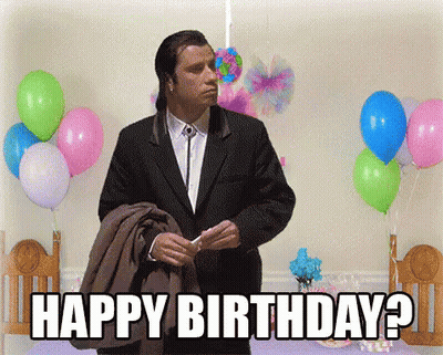 Man In Suit Says Happy Birthday In Front Of Balloons GIF