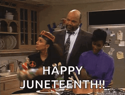 Man In Suit Says Happy Juneteenth Next To Two Women In Kitchen GIF