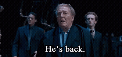 Man In Suit Says He's Back To Men GIF