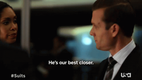 Man In Suit Says He's Our Best Closer In Front Of Woman GIF