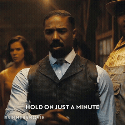 Man In Suit Says Hold On Just A Minute GIF