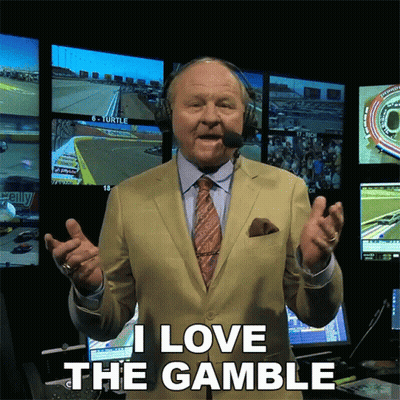 Man In Suit Says I Love The Gamble In Front Of Monitors GIF