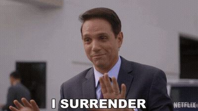 Man In Suit Says I Surrender In Front Of Netflix Logo GIF