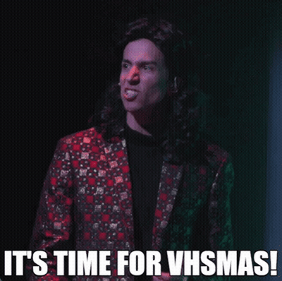 Man In Suit Says It's Time For VHSmas GIF