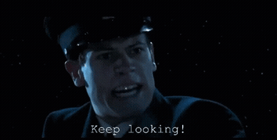 Man in Suit Says Keep Looking in the Dark