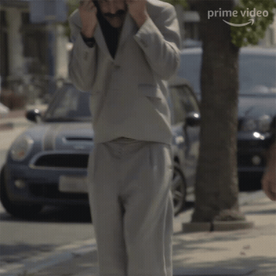 Man In Suit Says No Its Not Me In Front Of Car GIF