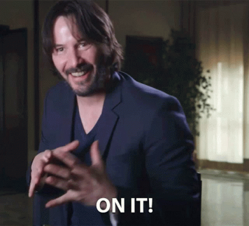 Man In Suit Says On It In Dark Room GIF