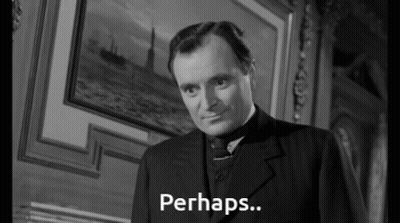 Man In Suit Says Perhaps Black And White GIF