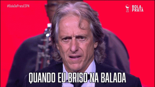 Man In Suit Says Quando Eu Brisa Na Balada On Red Background GIF