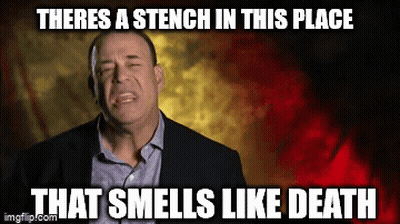 Man In Suit Says Stench Of Death GIF