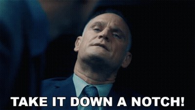 Man In Suit Says Take It Down A Notch GIF