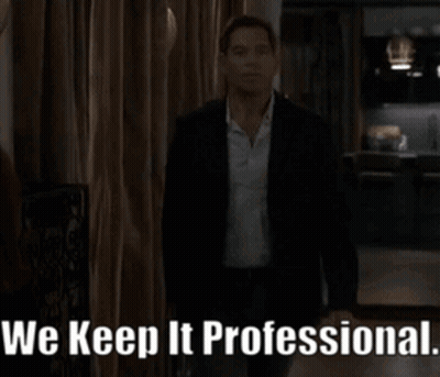 Man in Suit Says We Keep It Professional in Dark Room