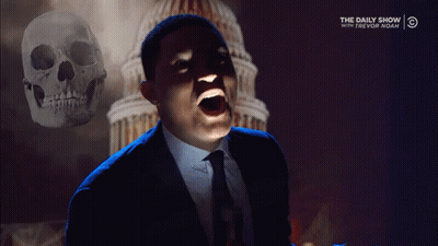 Man In Suit Screaming In Front Of Skull And Daily Show Logo GIF