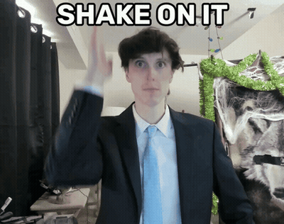 Man In Suit Shaking Hand In Front Of Shake Sign GIF