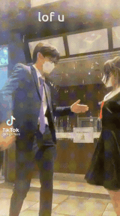 Man In Suit Shaking Hands With Girl In School Uniform GIF