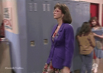 Man In Suit Shaking Hands With Man In Colorful Shirt GIF