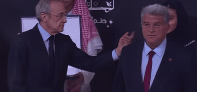 Man In Suit Shaking Hands With Man In Keffiyeh GIF