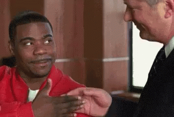 Man In Suit Shaking Hands With Man In Red Jacket GIF
