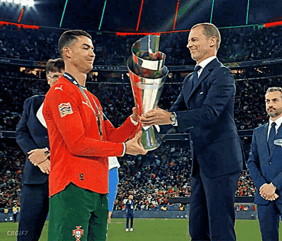 Man In Suit Shaking Hands With Soccer Player GIF