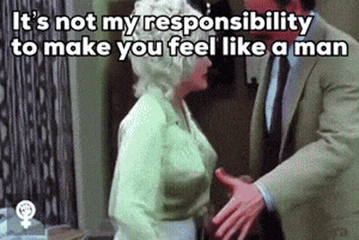 Man In Suit Shaking Hands With Woman In Green Top GIF
