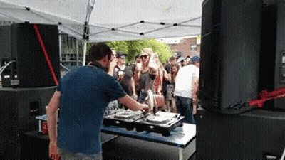 Man In Suit Signing Autographs For Fans GIF