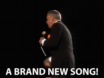 Man In Suit Singing 'A Brand New Song GIF