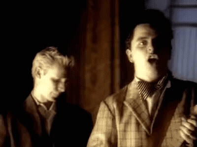 Man In Suit Singing Into Microphone GIF
