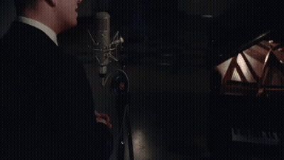 Man In Suit Singing Into Microphone GIF