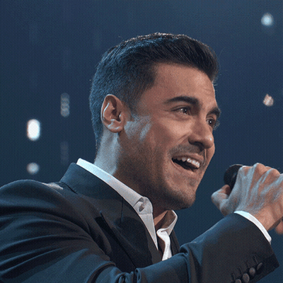 Man In Suit Singing Into Microphone GIF