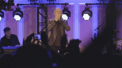Man In Suit Singing Into Microphone GIF