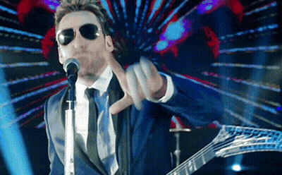 Man In Suit Singing Into Microphone GIF