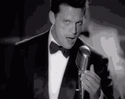 Man In Suit Singing Into Microphone GIF