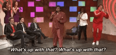 Man In Suit Singing Into Microphone With Audience GIF