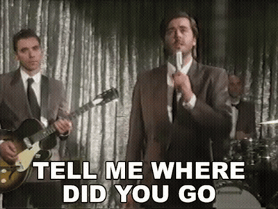 Man In Suit Singing Tell Me Where Did You Go GIF