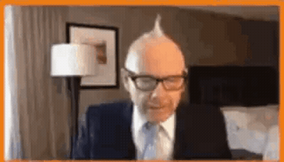 Man In Suit Sitting At Computer GIF