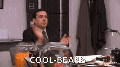 Man In Suit Sitting At Desk GIF
