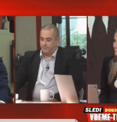 Man In Suit Sitting At Desk GIF