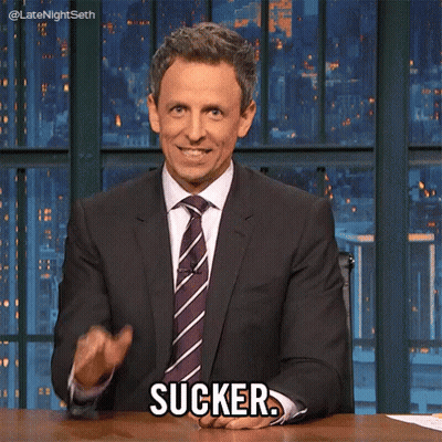 Man In Suit Sitting At Desk Saying Sucker GIF
