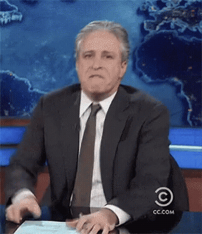 Man In Suit Sitting At Desk With Cc.com GIF