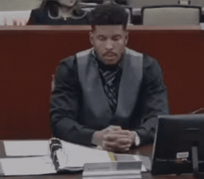 Man in Suit Sitting at Desk With Computer