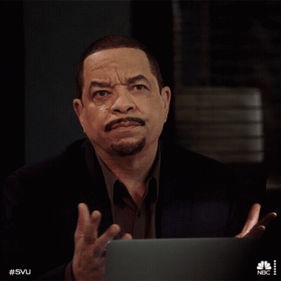 Man In Suit Sitting At Laptop With NBC Logo GIF