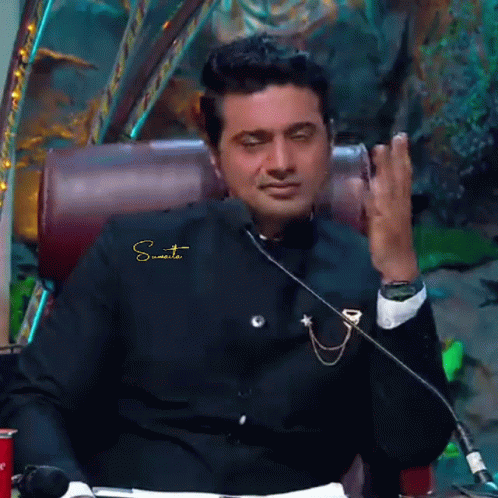 Man In Suit Sitting At Microphone Sumit GIF
