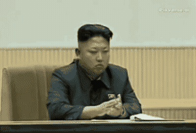 Man In Suit Sitting At Table GIF