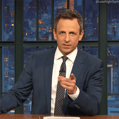 Man In Suit Sitting At Table #Latenightseth GIF