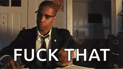 Man In Suit Sitting At Table With Book Saying Fuck That GIF