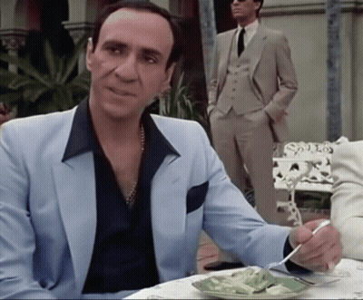 Man In Suit Sitting At Table With Food GIF