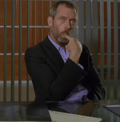 Man In Suit Sitting At Table With Laptop GIF