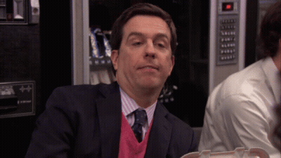Man In Suit Sitting At Vending Machine GIF