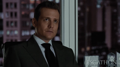 Man In Suit Sitting By Window Escathon GIF